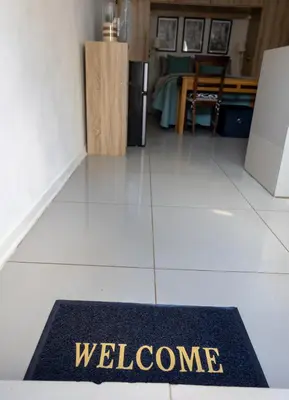 a welcome mat on the floor of a kitchen at Thorne's crip in Pretoria