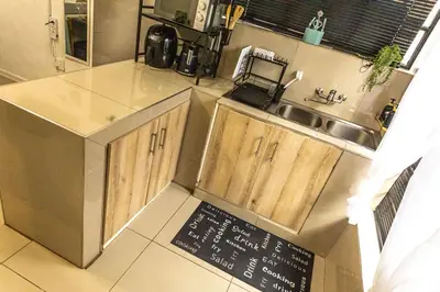 a kitchen with a sink and a counter top at Thorne's crip in Pretoria