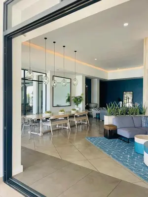 a living room with a couch and a table at Apartment at The Blyde in Pretoria