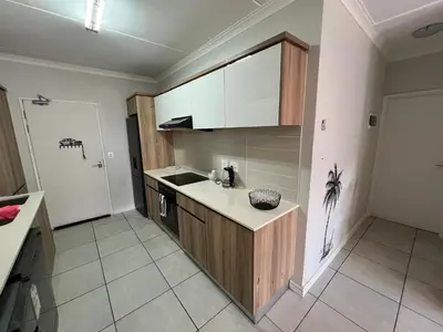 a kitchen with a sink and a counter top at Apartment at The Blyde in Pretoria
