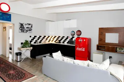 a living room with a coca cola soda machine at Buchan's Corner Unit 2 in Hartbeespoort