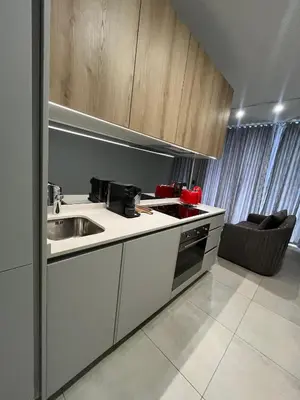 a kitchen with a sink and a counter top at The S-teemed at Ellipse in Midrand