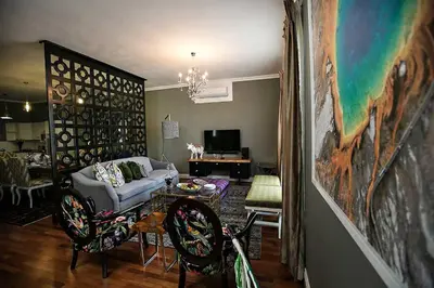 a living room with a couch and a table at Mavuta Boutique Apartments in Polokwane