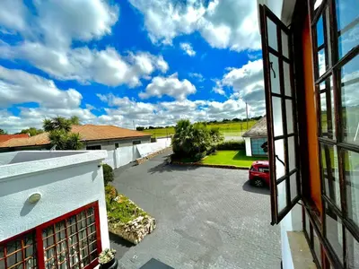a view of a driveway from a window of a house at Spacious Entire place with Balcony in Kempton Park