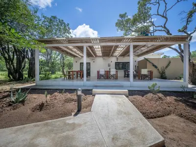 a pavilion with a picnic table in a yard at Memory Makers Bush Lodge in Hoedspruit