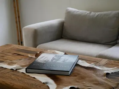a book sitting on top of a wooden table at Memory Makers Bush Lodge in Hoedspruit
