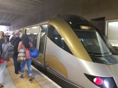 a group of people waiting for a subway train at Court Classique Suite Hotel in Pretoria