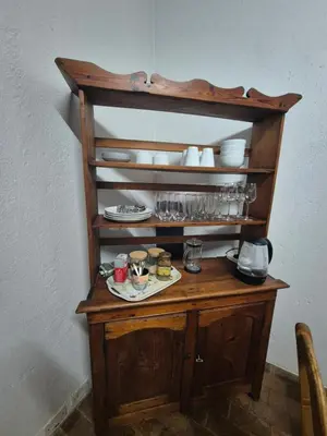 a wooden shelf with a plate of food on it at The Macadamia Nut Farm House in White River