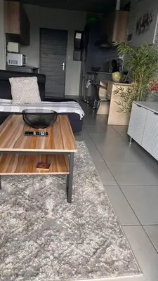 a living room with a table with a bowl on it at The Legacy Loft in Kyalami