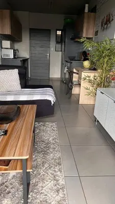 a living room with a bed and a table at The Legacy Loft in Kyalami