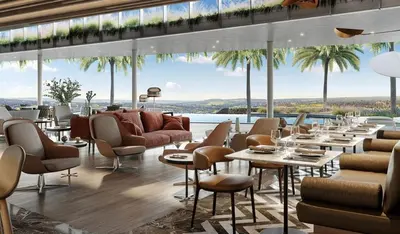a restaurant with tables and chairs and a view of the ocean at 4316 Ellipse luxury Apartment, Waterfall in Midrand