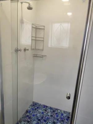 a bathroom with a shower with a glass door at 899 On Burlington in Pretoria