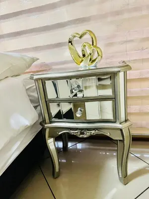 a gold end table with a gold heart on it at C-Rane Lodge B in Phalaborwa