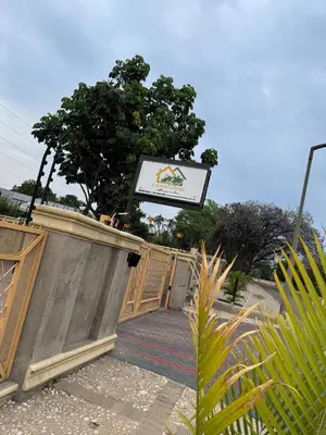 a wooden fence with a sign on top of it at C-Rane Lodge B in Phalaborwa