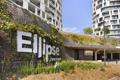 a building with a sign on the side of it at Skyline Serenity in Midrand