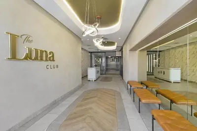 a waiting room with benches and a sign on the wall at Skyline Serenity in Midrand