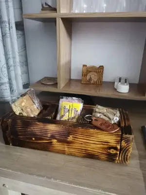 a basket sitting on a shelf with some bread at Impala Lily Kaya in Marloth Park