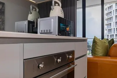 a microwave sitting on top of a counter in a room at The Orbit in Midrand