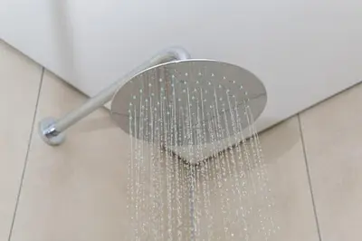 a shower head with a bunch of water at Golden Sun Suites in Midrand