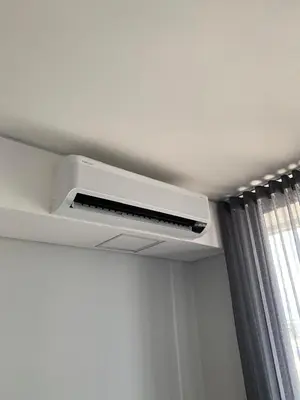 a air conditioner on a ceiling in a room at Ellipse Luxurious Tamarind Green Studio Experience in Midrand