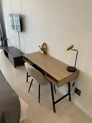 a desk with a lamp and a chair in a room at Ellipse Luxurious Tamarind Green Studio Experience in Midrand