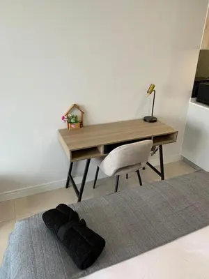 a desk with a chair and a desk with a lamp at Ellipse Luxurious Tamarind Green Studio Experience in Midrand