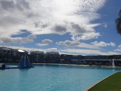 a large swimming pool in front of a resort at 3 Bedroom Apartment The Blyde Crystal Lagoon in Pretoria