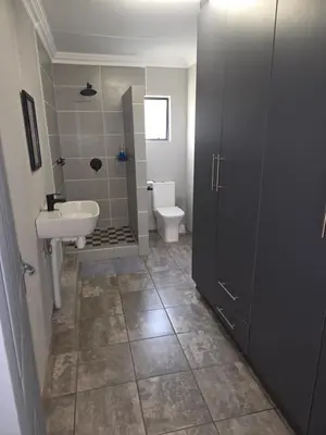 a bathroom with a sink and a toilet at The Good Samaritan 4 in Witbank