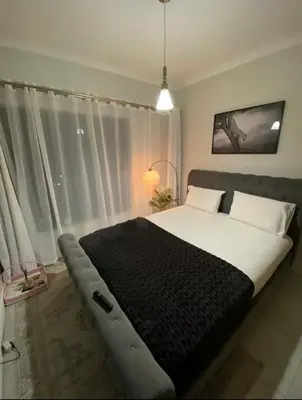 a bedroom with a large bed in front of a window at Blyde Lagoon View Facing Crystal 2 Large Bedrooms in Pretoria