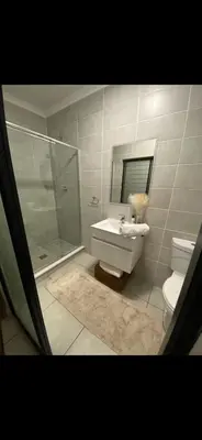 a bathroom with a sink and a shower and a toilet at Blyde Lagoon View Facing Crystal 2 Large Bedrooms in Pretoria