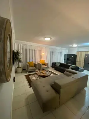 a living room with a couch and a table at Blyde Lagoon View Facing Crystal 2 Large Bedrooms in Pretoria
