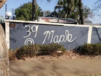 a sign that says madako on a wall at 39 Maple in Pretoria