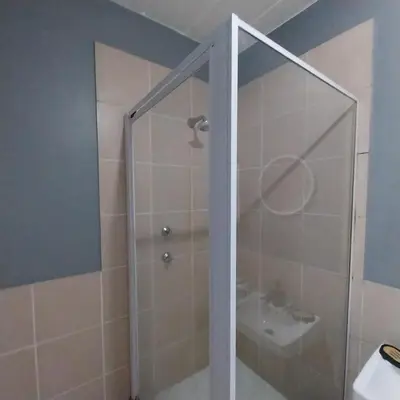 a bathroom with a shower and a sink at Travellor's relaxation unit, secure 1,5 bedrooms in Sandton