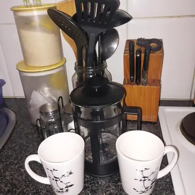 a counter with two coffee cups and a blender at Travellor's relaxation unit, secure 1,5 bedrooms in Sandton