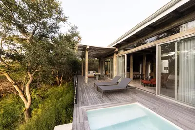 a house with a swimming pool on a deck at Kapama Karula in Kapama Private Game Reserve