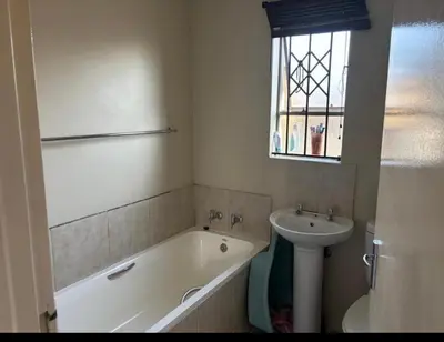 a bathroom with a sink and a bath tub and a sink at River luxury home in Chartwell