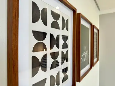 a wall art with a modern design in a hallway at Explore Ellipse - The Sage Apartment in Midrand