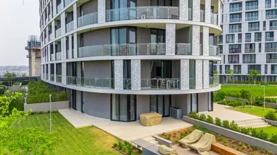 an apartment building with balconies and a yard at The Solace in Midrand