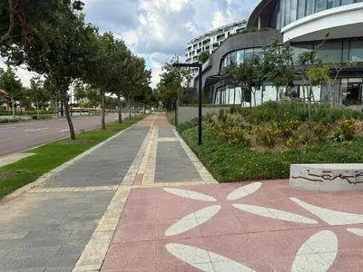an empty sidewalk in front of a building at Ellipse Luxary Apartment in Midrand