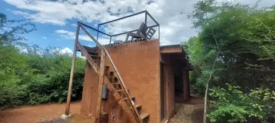 a building with a staircase on top of it at Hartbeest Bush Stay #2 in Hartbeespoort
