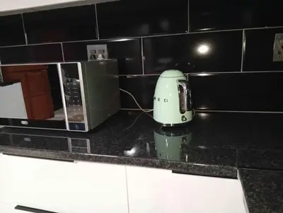 a mixer sitting on a counter next to a microwave at Joyful Home Bela-Bela in Bela-Bela