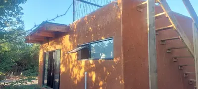 a house with a window on the side of it at Hartbeest Bush Stay #30 in Hartbeespoort
