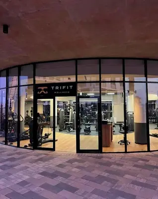 an empty gym with glass doors in a building at 4TEN15 Deluxe at Galileo, Ellipse in Midrand