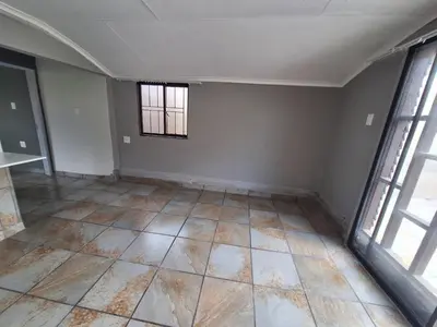 an empty room with a window and a tiled floor at Kinross house