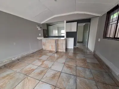 an empty room with a kitchen and a floor at Kinross house