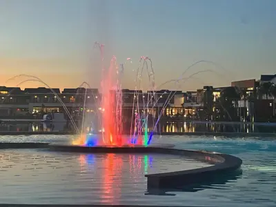 a water fountain in the middle of a body of water at The Exquisite apartment at its best ! in Pretoria