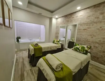 a hospital room with two beds and a window at Spectacular Lagoon Facing Apartment - The Blyde in Pretoria