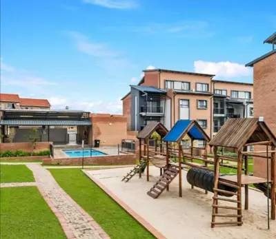 a playground with a slide at Nat's Villa 2 in Midrand