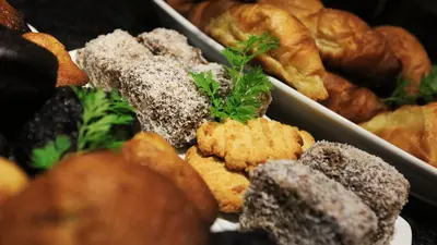 a bunch of different types of pastries on a table at Grand Kruger Lodge and Spa in Marloth Park