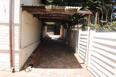 an entrance to a building with a fence at Boitumelo Guest House in Pretoria